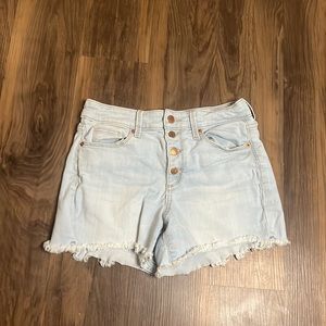 Light blue denim shorts with copper buttons